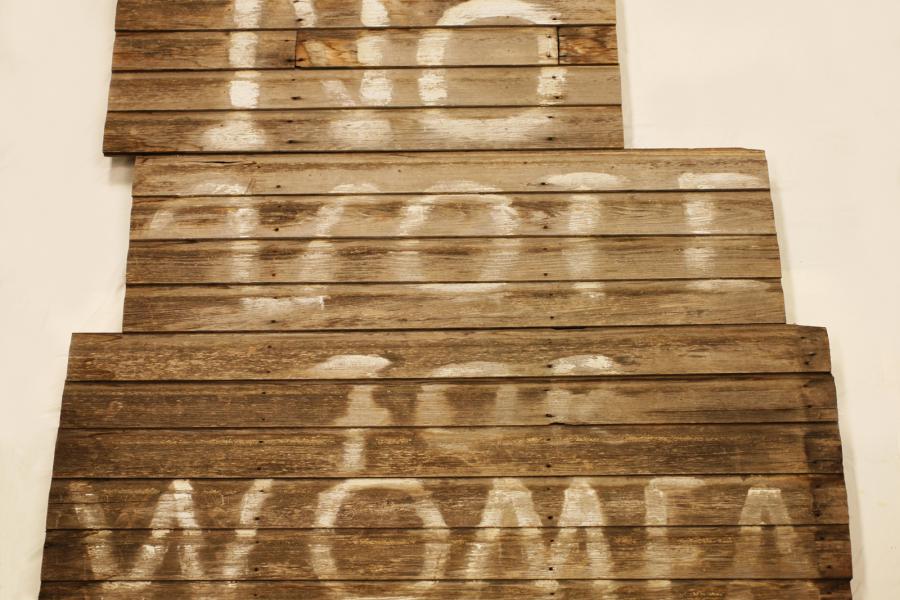 Sign saying "No votes for women."